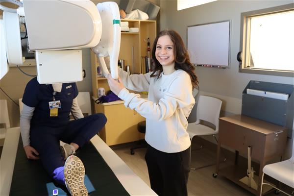 student using radiology x-ray machine