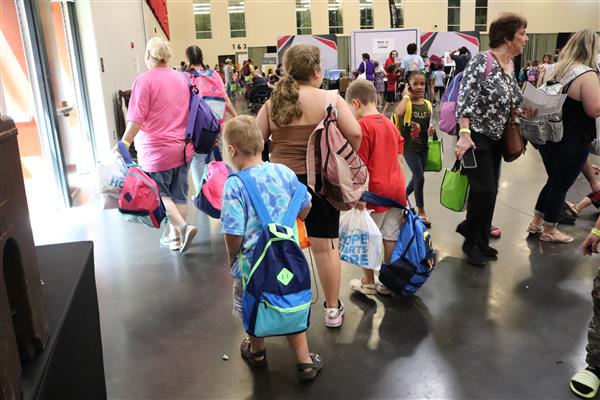 students with backpacks at Bash